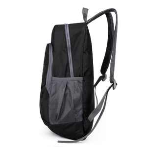Lightweight black-gray hiking backpack side view with breathable mesh pocket and ripstop fabric