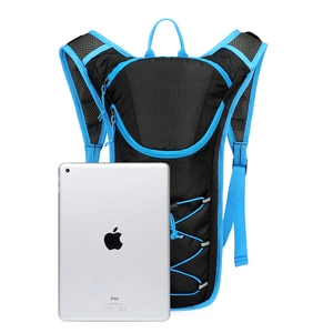 Compact black and blue cycling hydration backpack compared to tablet size for scale