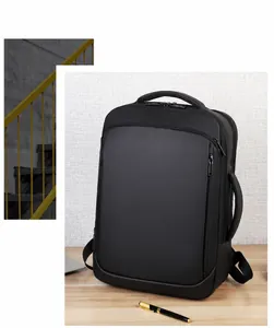 Waterproof black business laptop backpack on wood table, dual handles for versatile carrying