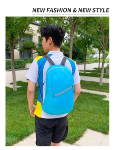 Side view of lightweight sky blue travel backpack with mesh straps on male model in park