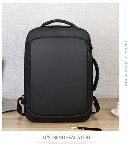 Detail of waterproof black business backpack with side USB charging port and sturdy handle