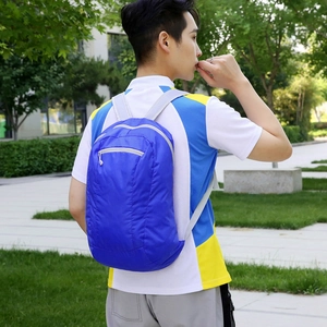 Foldable blue lightweight outdoor backpack for travel with large capacity and nylon fabric