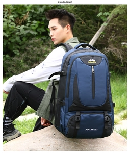 Side view of 85L hiking backpack featuring blue and black durable fabric on model