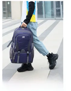 Detail of a large waterproof outdoor backpack featuring durable fabric and side mesh pocket
