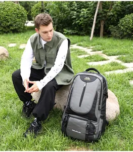 55L gray and black outdoor hiking backpack featuring ergonomic straps on grass