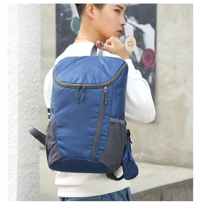 Detail of dark blue foldable outdoor backpack in lightweight tear-resistant nylon fabric