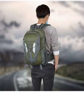 Close-up of lightweight waterproof hiking backpack with reflective strips and bungee cords