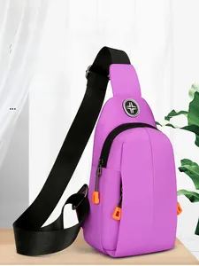 Detail of purple waterproof oxford chest bag with black adjustable strap and orange zipper puller