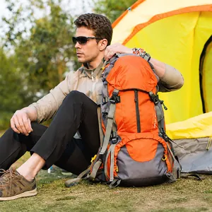Detail of 45+5L hiking backpack in orange and grey with mounting systems for camping