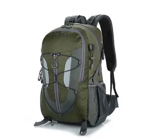 Side view of outdoor hiking backpack showing green waterproof fabric and elastic cords