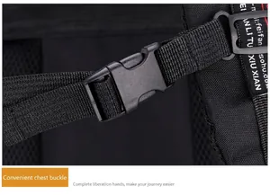 Macro detail of the adjustable chest buckle and durable nylon straps on a black backpack