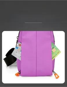 Detail view of purple oxford chest bag showing functional dual side zipper pockets