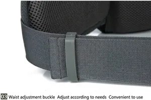 Detail of adjustable waist buckle and breathable mesh padding on grey hiking backpack
