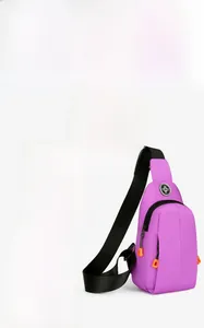 Detail view of purple chest bag with sturdy metal buckles and vibrant orange zipper pulls