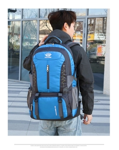 Close-up of 60L blue hiking backpack with reinforced straps and multi-pocket design