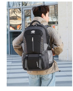 Close-up of 60L waterproof hiking backpack featuring gray and black ergonomic design