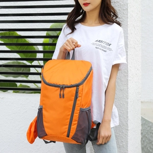 Foldable orange outdoor backpack with lightweight tear-resistant fabric for travel