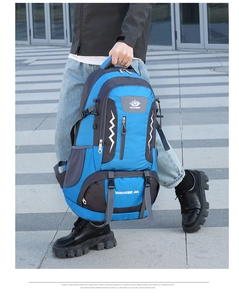 Detail view of 80L outdoor hiking backpack with reflective strips and reinforced straps