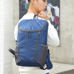 Foldable dark blue outdoor backpack with waterproof ripstop fabric and mesh side pockets