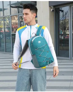 Detail of teal outdoor backpack with elastic bungee cords and mesh side pocket