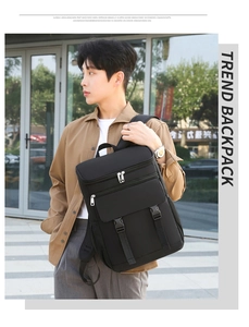 Detail of male model wearing the black high-density Oxford picnic backpack in urban setting