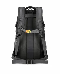 Detail of gray hiking backpack back with breathable mesh padding and orange chest strap