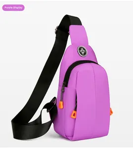 Macro shot of purple waterproof crossbody bag showing texture and orange zipper pulls