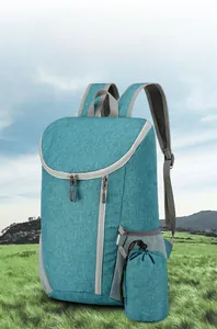 Detailed view of tiffany blue folding outdoor backpack with its compact storage pouch