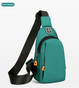Detail view of water-resistant green oxford crossbody bag with adjustable nylon strap