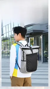 Detail of grey roll-top waterproof backpack fitting a 15-inch laptop for outdoor travel