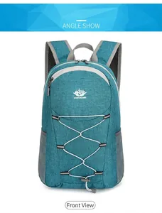 Detail of teal outdoor backpack with Vanaheimr logo and elastic bungee cords