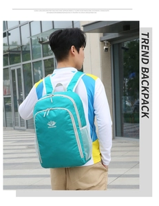 Outdoor shot of a cyan ultralight hiking backpack with side mesh pockets and front logo