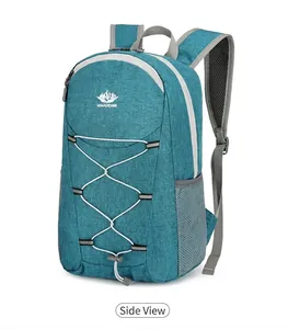 Detail view of foldable blue outdoor backpack with Vanaheimr logo and elastic cords