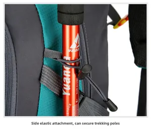 Detail of outdoor hiking backpack showing side elastic loops securing a trekking pole