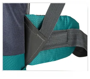 Detail of reinforced triangle stitching on the green and blue outdoor hiking backpack