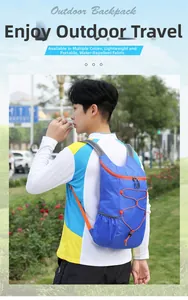 Close-up of blue water-resistant outdoor backpack featuring orange contrast drawstring