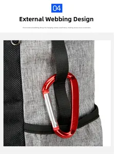 Detail of external webbing system on hiking backpack with a red metal carabiner clip