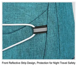 Close-up of teal hiking backpack featuring a safety reflective strip and elastic cord