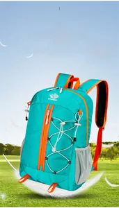 Lightweight turquoise outdoor backpack with orange straps shown floating with feathers