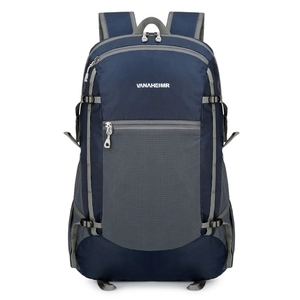 Lightweight foldable outdoor backpack in navy blue with waterproof ripstop fabric for hiking