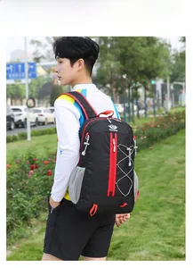Detail of a lightweight black outdoor backpack with red zippers and side mesh pockets