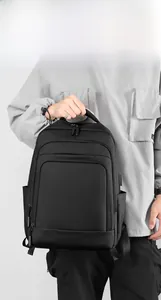 Close-up of black waterproof business backpack with layered zippers and side pockets