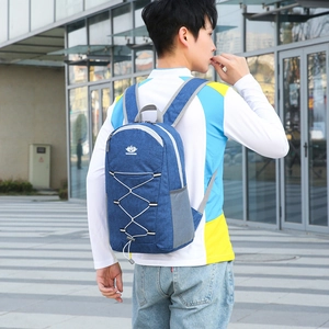 Foldable large capacity outdoor backpack in navy blue with elastic cords and mesh side pocket
