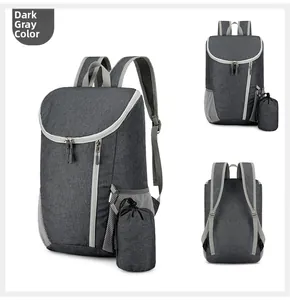 Detail of dark grey foldable backpack with water-resistant fabric and storage pouch