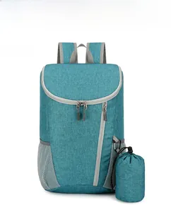 Close-up of lightweight teal water-resistant backpack and matching drawstring storage pouch
