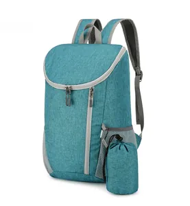 Detail of teal waterproof backpack showing durable fabric texture and side mesh pockets