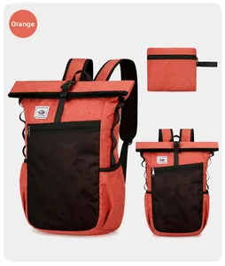 Detail of lightweight orange waterproof folding backpack showing full and compact states