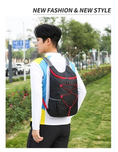 Close-up of lightweight hiking backpack with red zippers and side mesh pocket detail