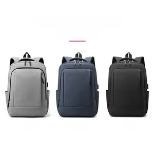 Business laptop backpacks in grey, dark blue, and black showing side USB charging port