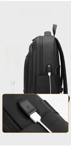 Detail of the external USB charging port on the durable black nylon business backpack